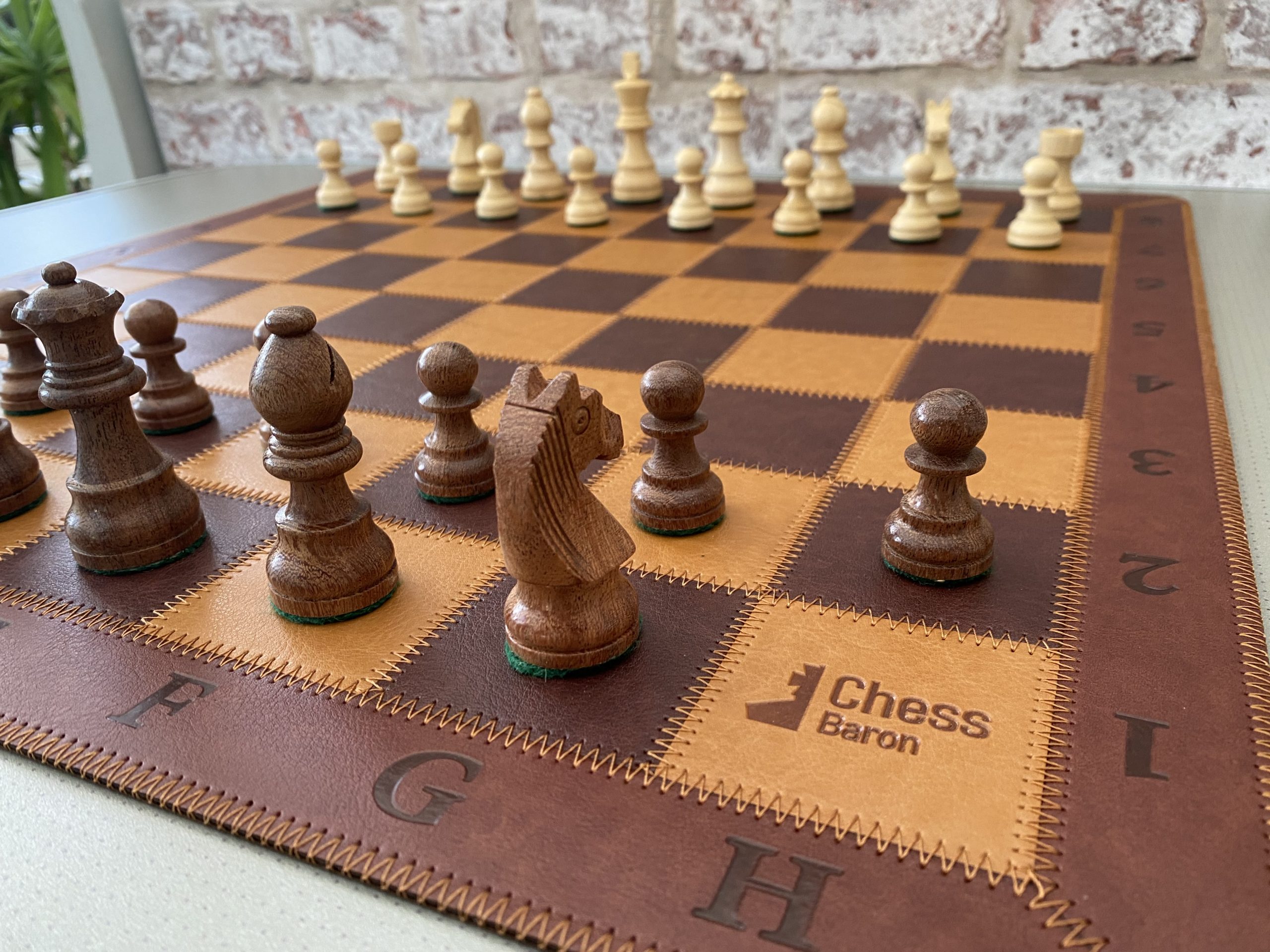 A group of chess pieces sitting on top of a chess board photo